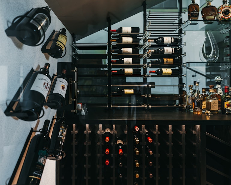 Custom Shelving and Feature Wall in Silverleaf Custom Wine Cellar